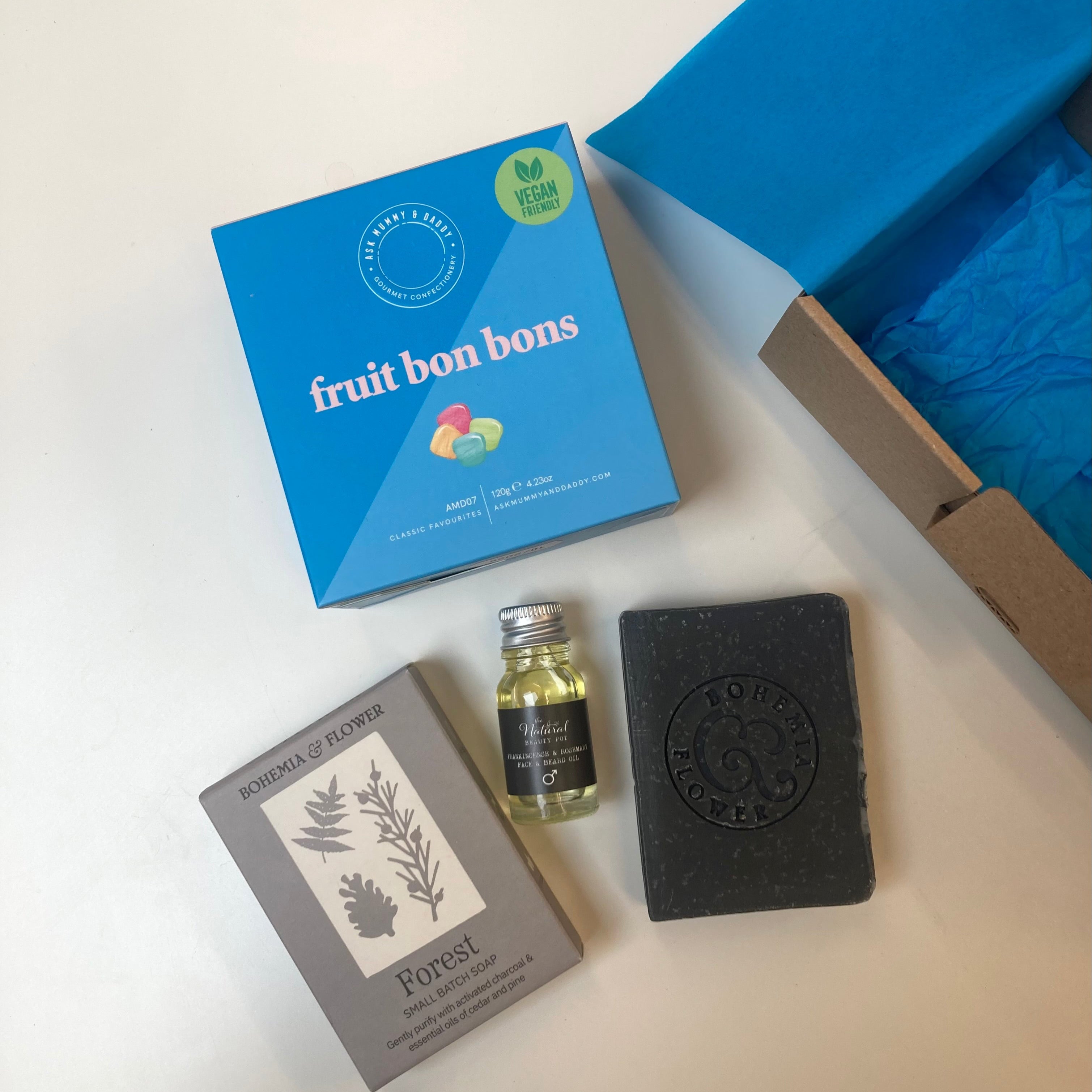 Father day gift items including 'fruit bon bons', a small bottle, and a natural soap bar 