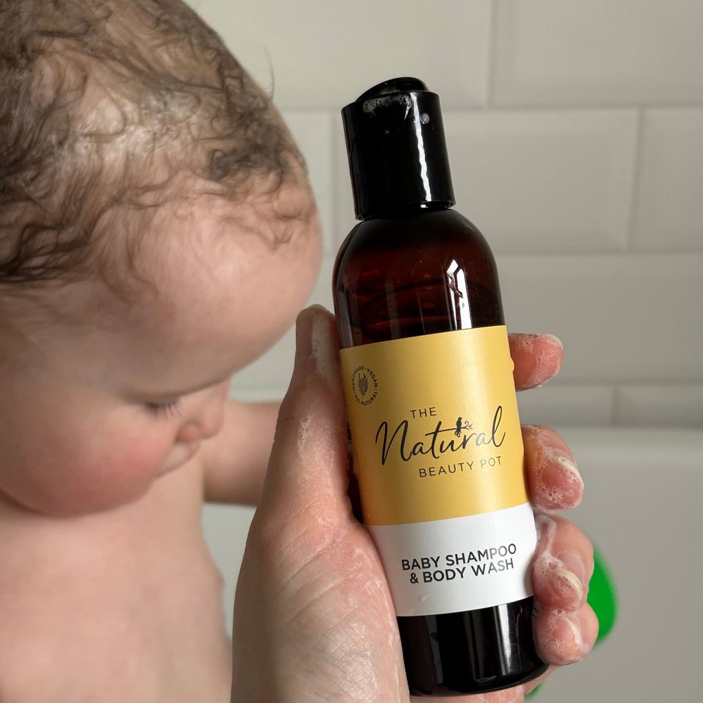 Natural Baby Shampoo and Body Wash baby in background