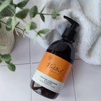 Bottle of 'The Natural  Beauty Pot' sulphate and paraben free hand and body wash in Orange Cinnamon and Clove.