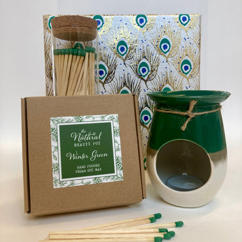 Candle kit with matches and decorative packaging on a white background