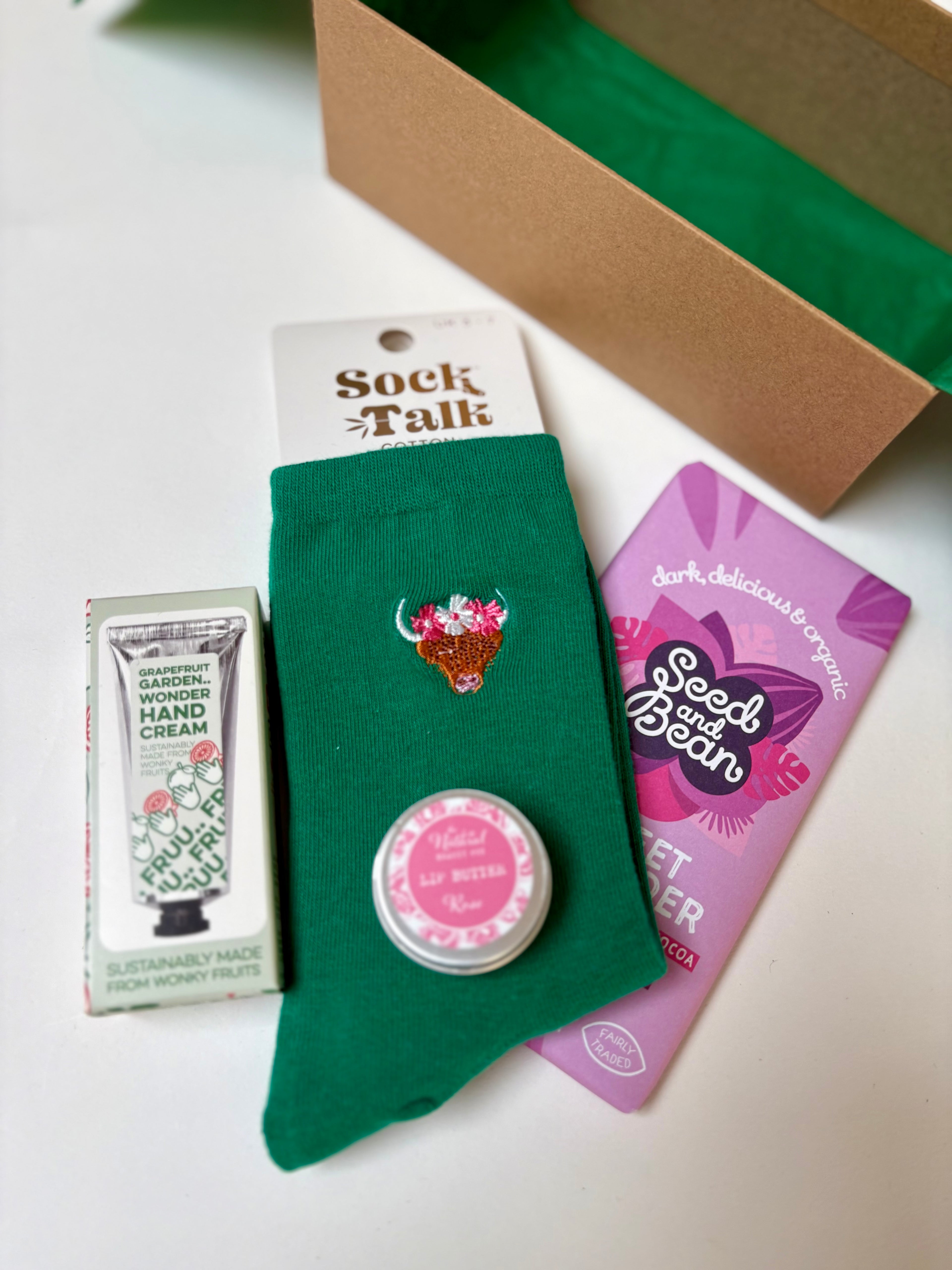 thoughtful sustainable inspired gift box, vegan chocolate, grapefruit hand cream, rose lip balm, soft cotton socks