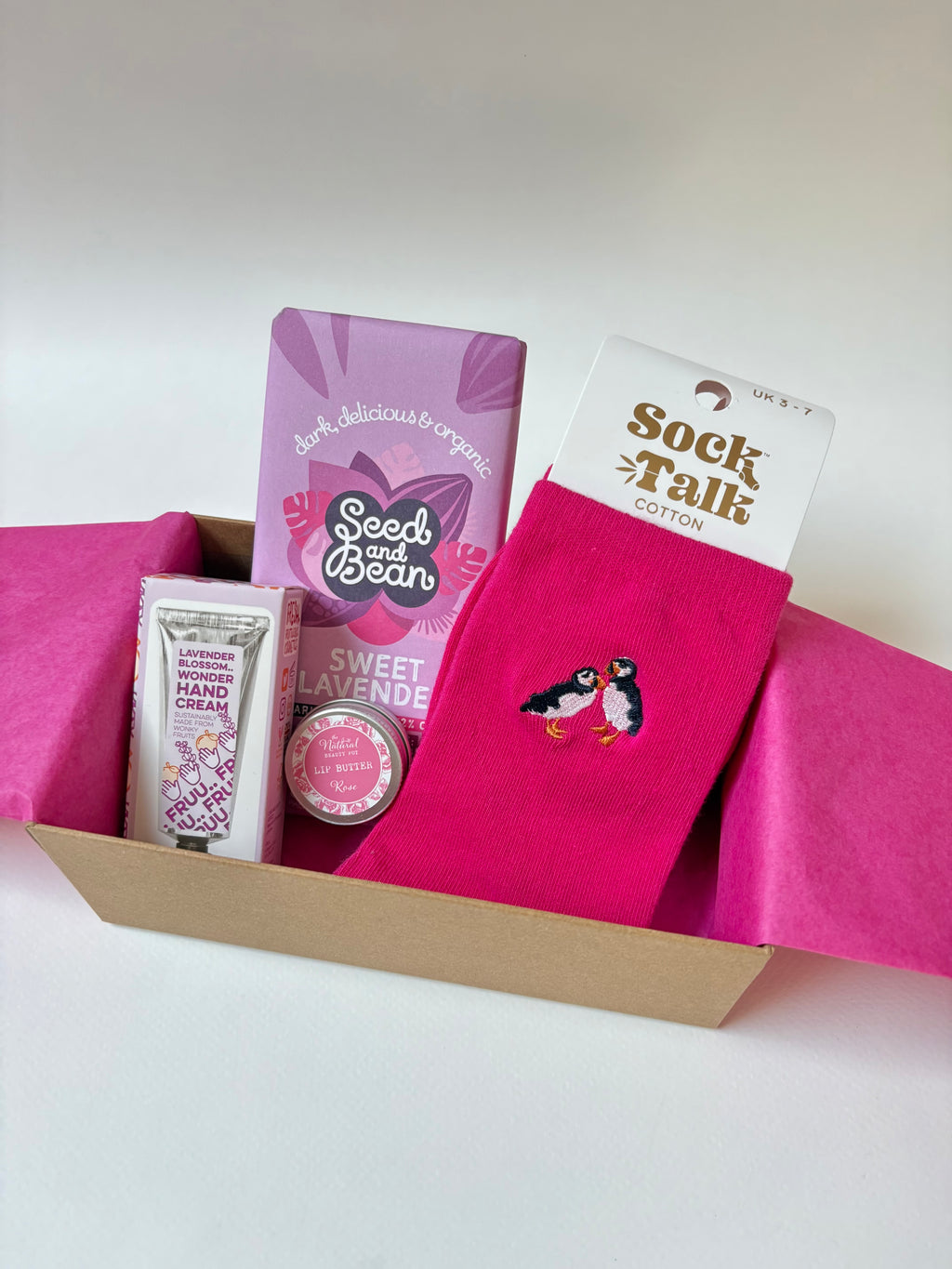 well being gift Pink socks, vegan chocolate, natural lip butter and lavender hand cream 