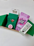 gift box under £25 green and pink cotton socks, vegan chocolate, organic lip butter, natural hand cream 